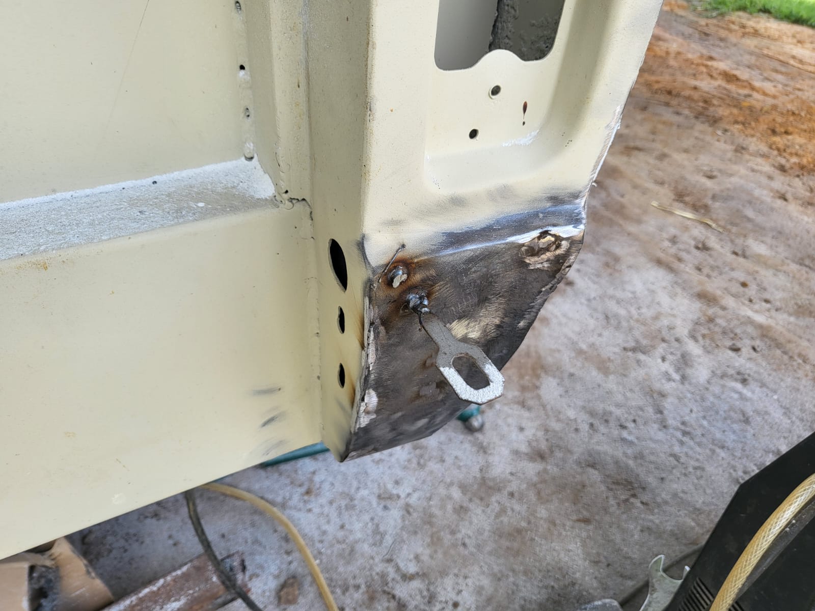 F100 body repair with replacement steel section welded into the cab